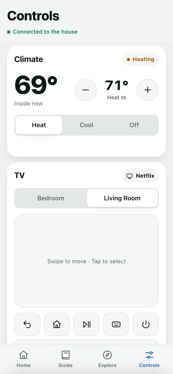 Phone controls: the thermostat at 69 degrees, heating to 71, above the TV remote